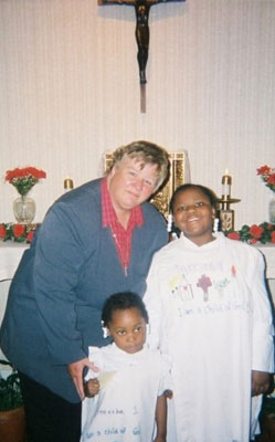 Clements-w-2-Children-in-Front-of-Altar